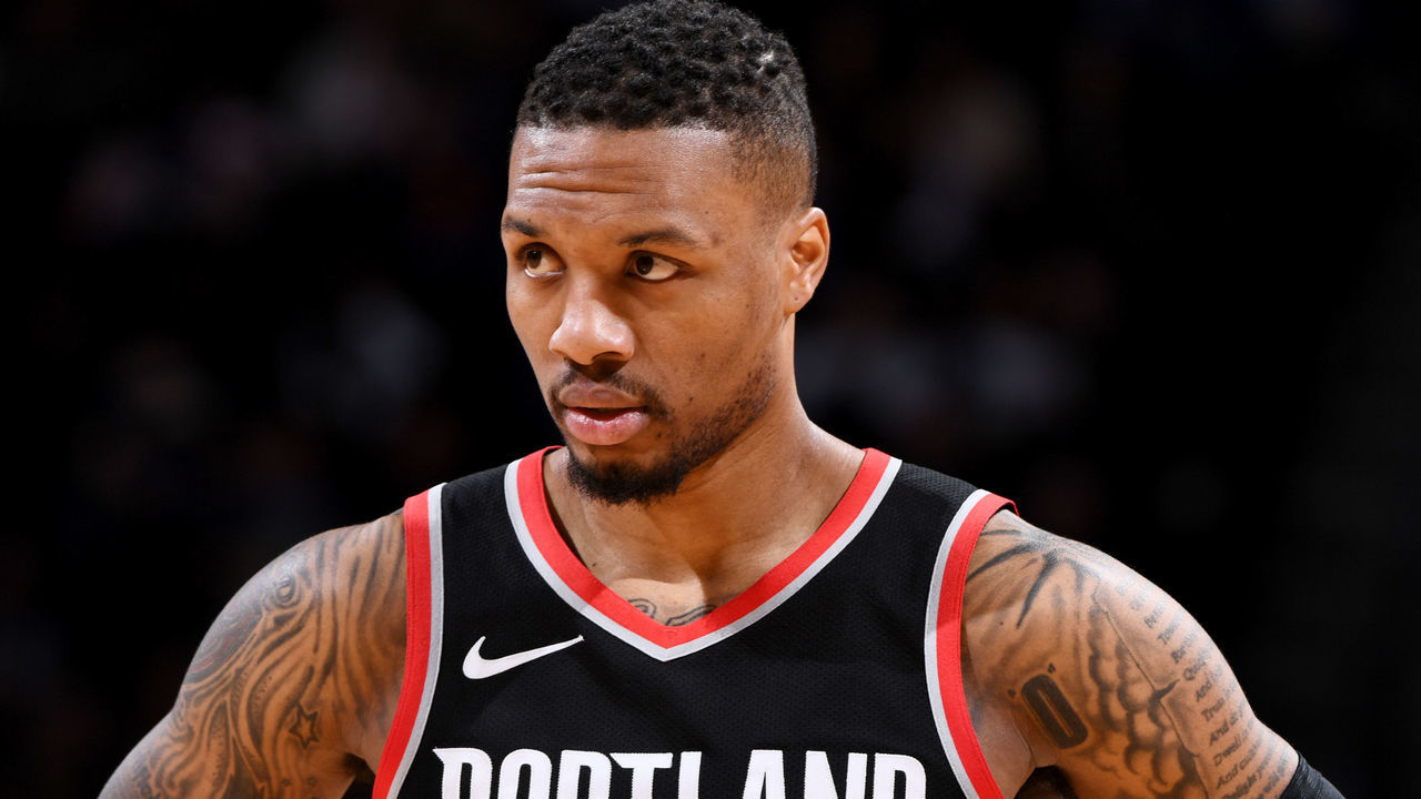 DENVER, CO - JANUARY 22: Damian Lillard #0 of the Portland Trail Blazers looks on during the game against the Denver Nuggets on January 22, 2018 at the Pepsi Center in Denver, Colorado. NOTE TO USER: User expressly acknowledges and agrees that, by downloading and/or using this Photograph, user is consenting to the terms and conditions of the Getty Images License Agreement. Mandatory Copyright Notice: Copyright 2018 NBAE