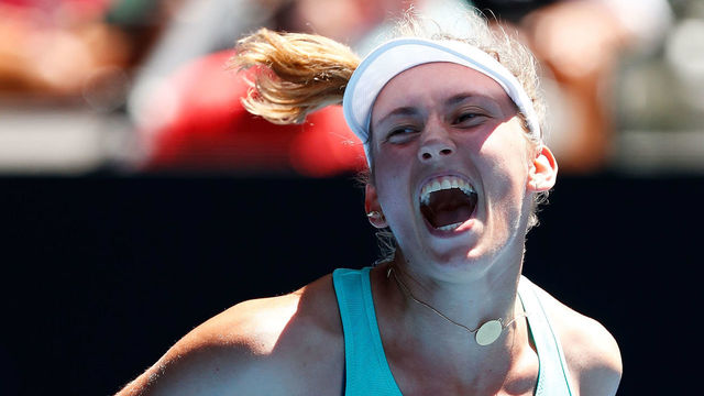 MELBOURNE, AUSTRALIA - JANUARY 23: Elise Mertens of Belgium celebrates winning match point in her quarter-final match against Elina Svitolina of Ukraine on day nine of the 2018 Australian Open at Melbourne Park on January 23, 2018 in Melbourne, Australia.