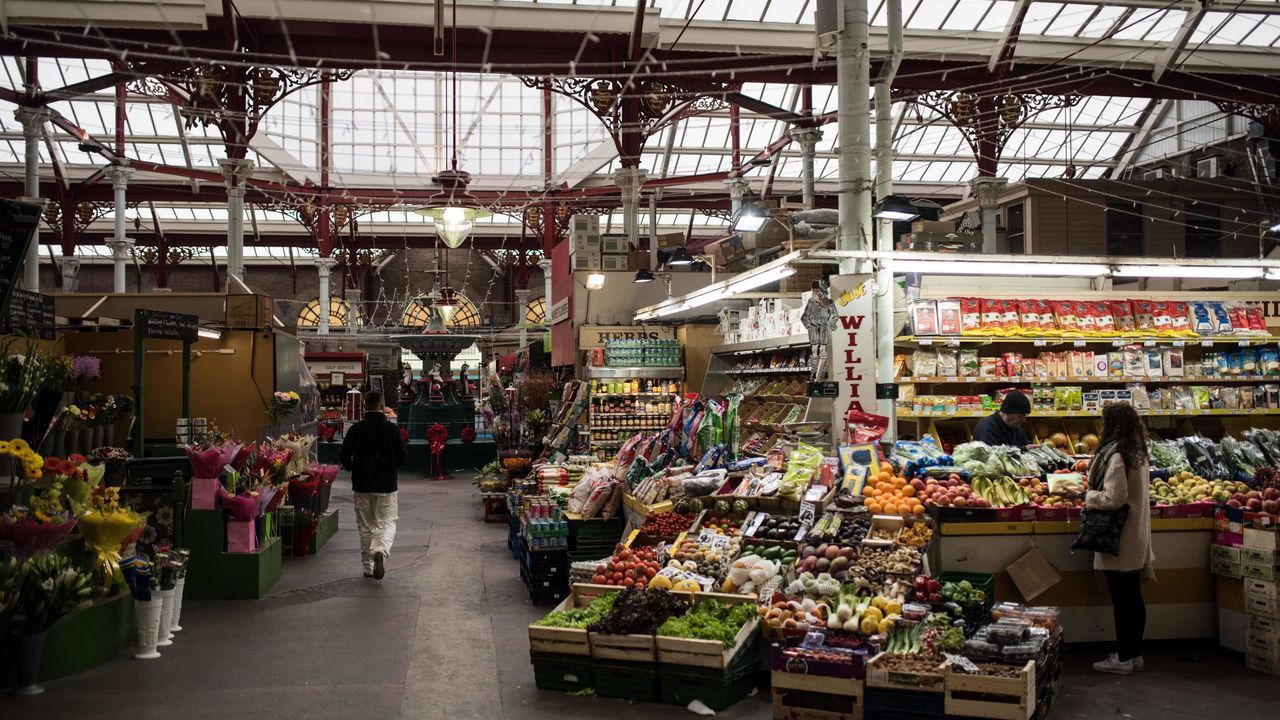 Traders open for business in the Central Market of St Helier, on the British island of Jersey, on November 9, 2017. Jersey is a British Crown Dependency, with a population of 100,000. The EU on has pushed for Europe to draw up a blacklist of tax havens after the 'Paradise Papers' revealed loopholes used by Apple and Nike as well as celebrities such as Formula One champion Lewis Hamilton. / AFP PHOTO / OLI SCARFF