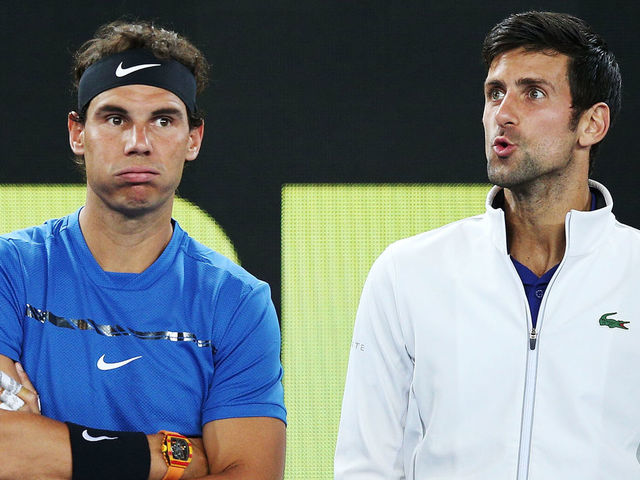 MELBOURNE, AUSTRALIA - JANUARY 10: Rafael Nadal of Spain (L) and Novak Djokovic of Serbia hits a forehand react after watching a video replay while on the sidelines during the Tie Break Tens ahead of the 2018 Australian Open at Margaret Court Arena on January 10, 2018 in Melbourne, Australia.