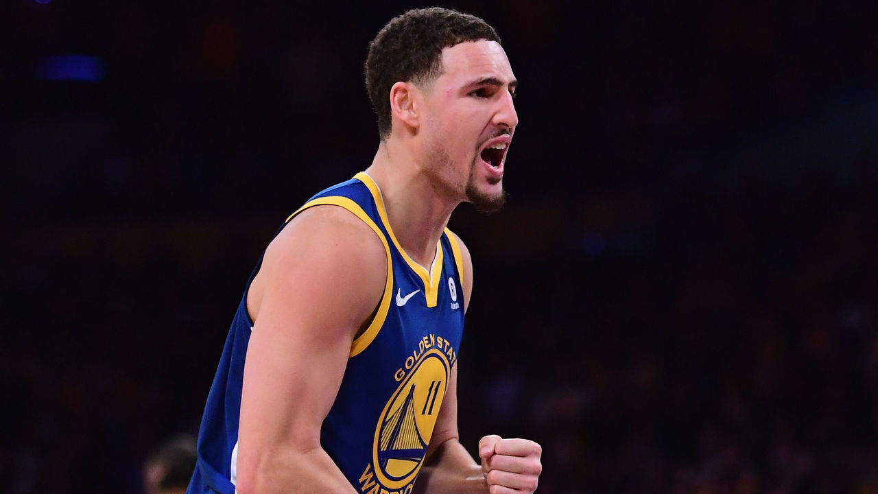 LOS ANGELES, CA - DECEMBER 18: Klay Thompson #11 of the Golden State Warriors celebrates a 116-114 win over the Los Angeles Lakers at the buzzer at Staples Center on December 18, 2017 in Los Angeles, California.
