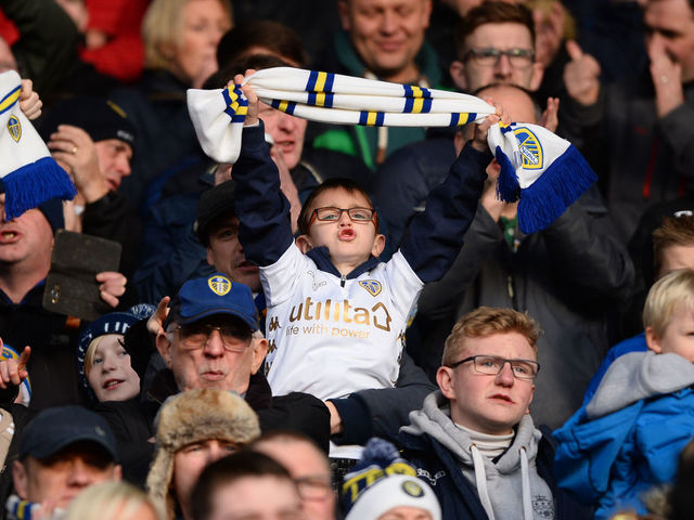 LEEDS, ENGLAND - JANUARY 20: A young Leeds United fan sings during the Sky Bet Championship match between Leeds United and Millwall at Elland Road on January 20, 2018 in Leeds, England.