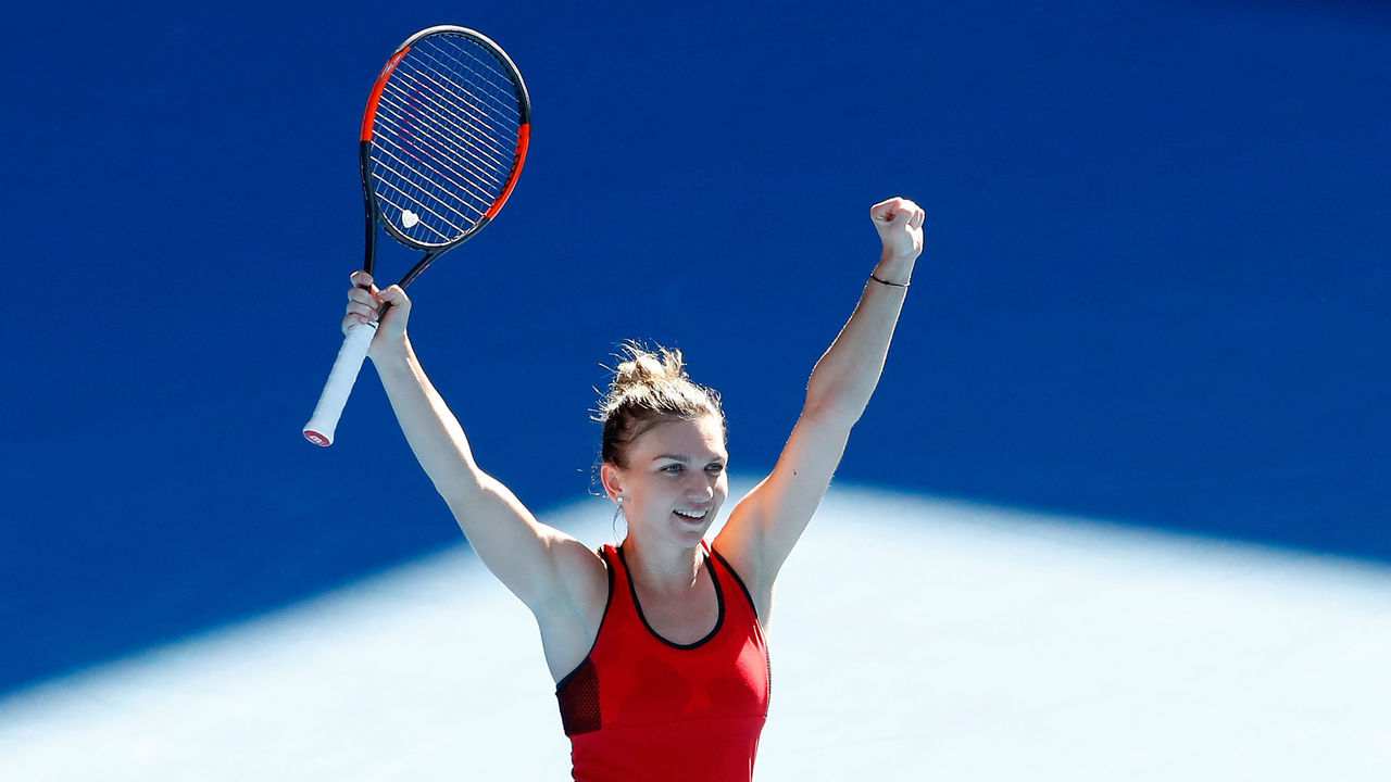 MELBOURNE, AUSTRALIA - JANUARY 24: Simona Halep of Romania celebrates winning match point in her quarter-final match against Karolina Pliskova of the Czech Republic on day 10 of the 2018 Australian Open at Melbourne Park on January 24, 2018 in Melbourne, Australia.