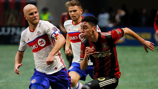 ATLANTA, GA - OCTOBER 22: Miguel Almiron #10 of Atlanta United pushes the ball against Michael Bradley #4 of Toronto FC at Mercedes-Benz Stadium on October 22, 2017 in Atlanta, Georgia.