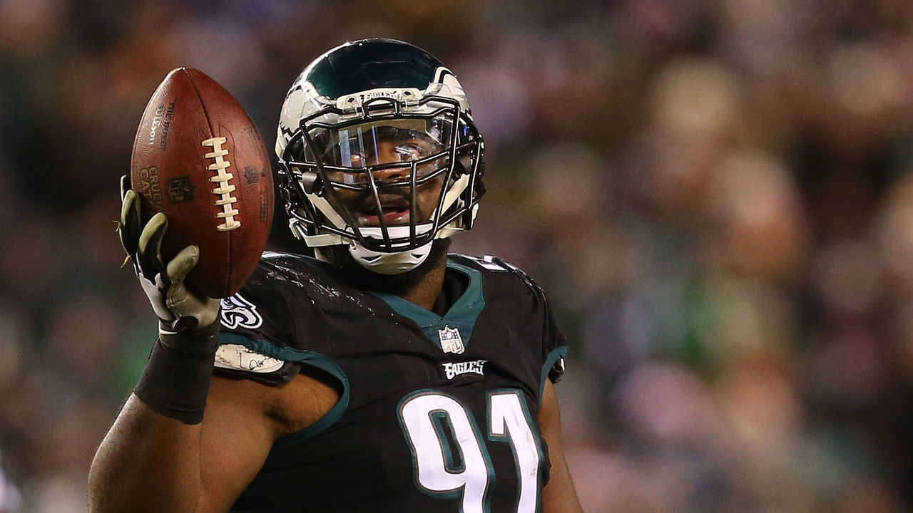 PHILADELPHIA, PA - DECEMBER 25: Fletcher Cox #91 of the Philadelphia Eagles holds up the ball after recovering a fumble against the Oakland Raiders during the third quarter of a game at Lincoln Financial Field on December 25, 2017 in Philadelphia, Pennsylvania. The Eagles defeated the Raiders 19-10.