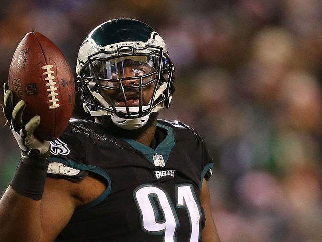 PHILADELPHIA, PA - DECEMBER 25: Fletcher Cox #91 of the Philadelphia Eagles holds up the ball after recovering a fumble against the Oakland Raiders during the third quarter of a game at Lincoln Financial Field on December 25, 2017 in Philadelphia, Pennsylvania. The Eagles defeated the Raiders 19-10.