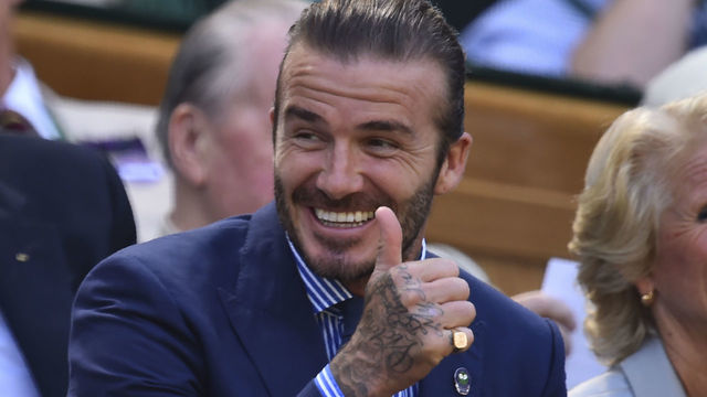 Former England footballer David Beckham gestures as he sits in the Royal Box on Centre Court on the fifth day of the 2017 Wimbledon Championships at The All England Lawn Tennis Club in Wimbledon, southwest London, on July 7, 2017. / AFP PHOTO / Glyn KIRK / RESTRICTED TO EDITORIAL USE