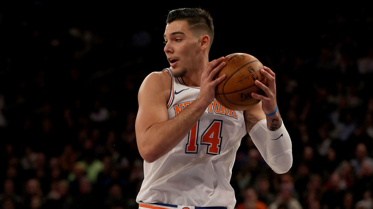 NEW YORK, NEW YORK - JANUARY 02: Willy Hernangomez #14 of the New York Knicks grabs the rebound in the second half against the San Antonio Spurs at Madison Square Garden on January 02, 2018 in New York City.