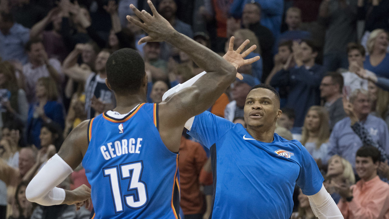 OKLAHOMA CITY, OK - NOVEMBER 22: Paul George #13 of the Oklahoma City Thunder and Russell Westbrook #0 of the Oklahoma City Thunder celebrate during the second half of a NBA game against the Golden State Warriors at the Chesapeake Energy Arena on November 22, 2017 in Oklahoma City, Oklahoma.