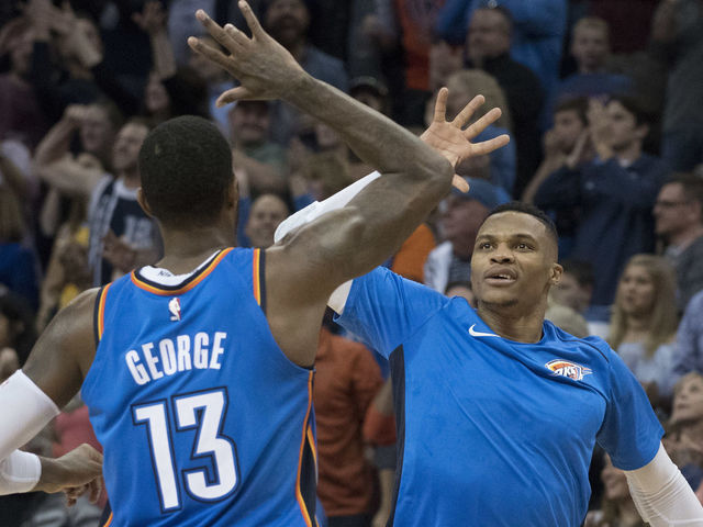 OKLAHOMA CITY, OK - NOVEMBER 22: Paul George #13 of the Oklahoma City Thunder and Russell Westbrook #0 of the Oklahoma City Thunder celebrate during the second half of a NBA game against the Golden State Warriors at the Chesapeake Energy Arena on November 22, 2017 in Oklahoma City, Oklahoma.
