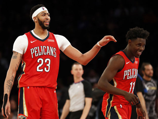 Holiday officially gives Pelicans a Big 3