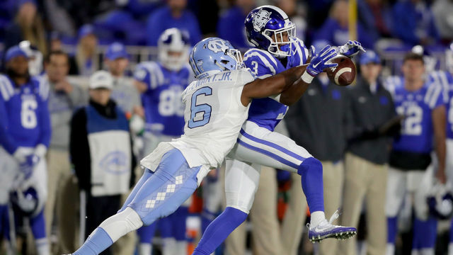 DURHAM, NC - NOVEMBER 10: M.J. Stewart #6 of the North Carolina Tar Heels breaks up a pass to T.J. Rahming #3 of the Duke Blue Devils during their game at Wallace Wade Stadium on November 10, 2016 in Durham, North Carolina.