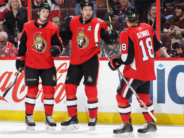 OTTAWA, ON - JANUARY 9: Mark Stone #61 of the Ottawa Senators celebrates his second period goal against the Chicago Blackhawks with teammates Thomas Chabot #72 and Ryan Dzingel #18 at Canadian Tire Centre on January 9, 2018 in Ottawa, Ontario, Canada.