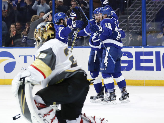 TAMPA, FL - JANUARY 18: Tampa Bay Lightning left wing Ondrej Palat (18) celebrates with Tampa Bay Lightning center Steven Stamkos (91) and Tampa Bay Lightning right wing Nikita Kucherov (86) after scoring a goal on Vegas Golden Knights goaltender Marc-Andre Fleury (29) in the second period of the NHL game between the Vegas Golden Knights and Tampa Bay Lightning on January 18, 2018 at Amalie Arena in Tampa, FL.
