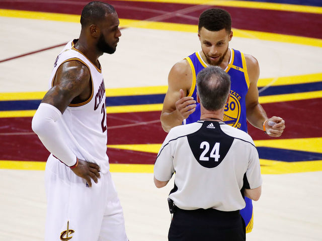CLEVELAND, OH - JUNE 09: LeBron James #23 of the Cleveland Cavaliers and Stephen Curry #30 of the Golden State Warriors discuss the call with referee Mike Callahan #24 during the first half in Game 4 of the 2017 NBA Finals at Quicken Loans Arena on June 9, 2017 in Cleveland, Ohio.