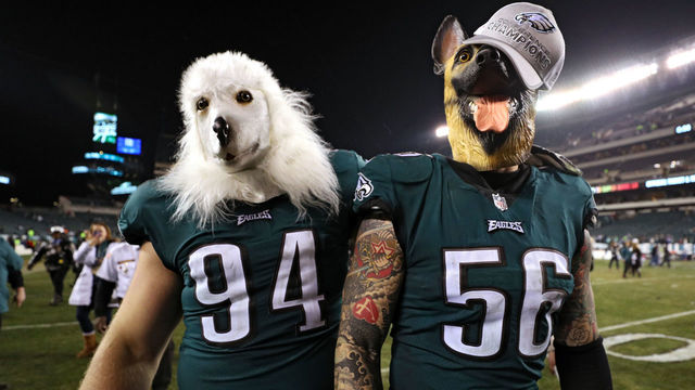 PHILADELPHIA, PA - JANUARY 21: Beau Allen #94 and Chris Long #56 of the Philadelphia Eagles celebrates their teams win while wearing a dog masks over the Minnesota Vikings in the NFC Championship game at Lincoln Financial Field on January 21, 2018 in Philadelphia, Pennsylvania.
