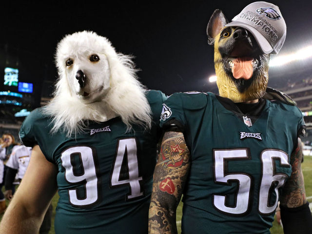 PHILADELPHIA, PA - JANUARY 21: Beau Allen #94 and Chris Long #56 of the Philadelphia Eagles celebrates their teams win while wearing a dog masks over the Minnesota Vikings in the NFC Championship game at Lincoln Financial Field on January 21, 2018 in Philadelphia, Pennsylvania.