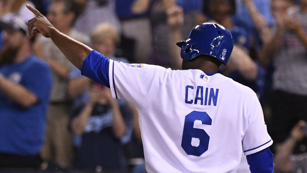 KANSAS CITY, MO -JUNE 8: Lorenzo Cain #6 of the Kansas City Royals points to Mike Moustakas #8 as he scores on Moustakas' single in the seventh inning against the Houston Astros at Kauffman Stadium on June 8, 2017 in Kansas City, Missouri.