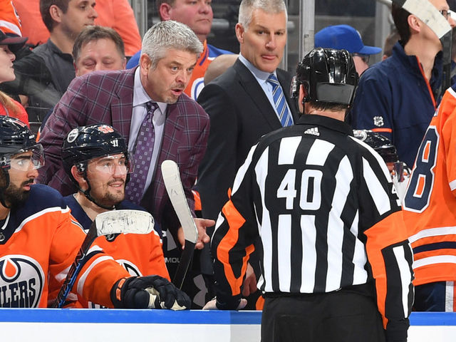 EDMONTON, AB - JANUARY 25: Todd McLellan of the Edmonton Oilers exchanges words with an official during the game against the Calgary Flames on January 25, 2017 at Rogers Place in Edmonton, Alberta, Canada.