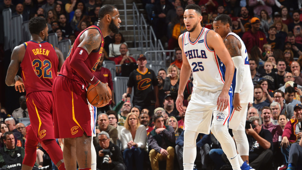 CLEVELAND, OH - DECEMBER 9: LeBron James #23 of the Cleveland Cavaliers dribbles the ball Ben Simmons #25 of the Philadelphia 76ers on December 9, 2017 at Quicken Loans Arena in Cleveland, Ohio. Mandatory Copyright Notice: Copyright 2017 NBAE