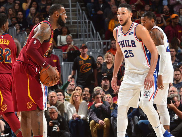 CLEVELAND, OH - DECEMBER 9: LeBron James #23 of the Cleveland Cavaliers dribbles the ball Ben Simmons #25 of the Philadelphia 76ers on December 9, 2017 at Quicken Loans Arena in Cleveland, Ohio. Mandatory Copyright Notice: Copyright 2017 NBAE