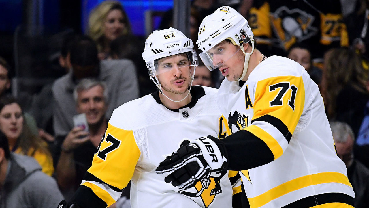 LOS ANGELES, CA - JANUARY 18: Sidney Crosby #87 and Evgeni Malkin #71 of the Pittsburgh Penguins talk before the faceoff of a power play against the Los Angeles Kings during the third period of a Penguins win at Staples Center on January 18, 201 in Los Angeles, California.