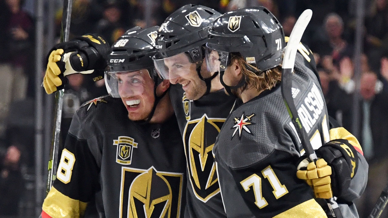 LAS VEGAS, NV - JANUARY 23: Colin Miller (C) #6 of the Vegas Golden Knights is congratulated by teammates Nate Schmidt #88 and William Karlsson #71 after Miller scored a second-period goal against the Columbus Blue Jackets during their game at T-Mobile Arena on January 23, 2018 in Las Vegas, Nevada.