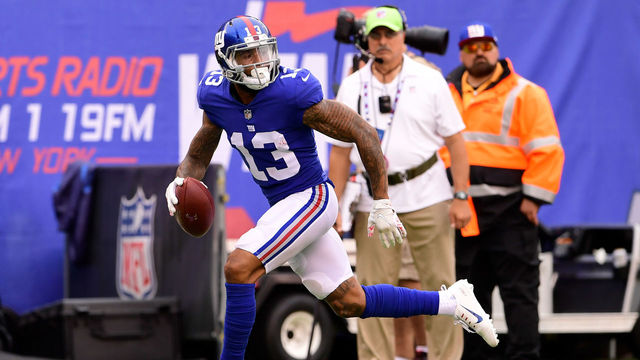 EAST RUTHERFORD, NJ - OCTOBER 08: Odell Beckham #13 of the New York Giants scores on a fourth quarter touchdown reception against the Los Angeles Chargers during an NFL game at MetLife Stadium on October 8, 2017 in East Rutherford, New Jersey. The Los Angeles Chargers defeated the New York Giants 27-22.