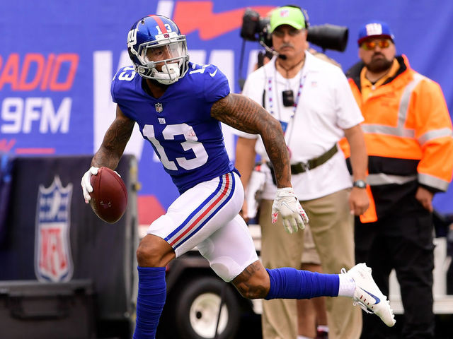 EAST RUTHERFORD, NJ - OCTOBER 08: Odell Beckham #13 of the New York Giants scores on a fourth quarter touchdown reception against the Los Angeles Chargers during an NFL game at MetLife Stadium on October 8, 2017 in East Rutherford, New Jersey. The Los Angeles Chargers defeated the New York Giants 27-22.