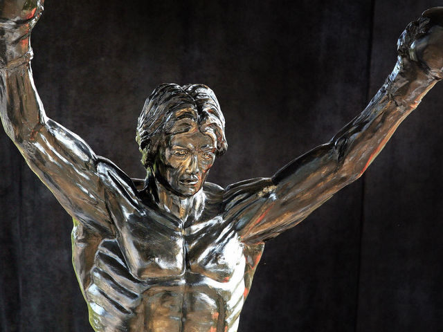 A statue of the film character Rocky Balboa is seen in the village of Zitiste, 19 August 2007. The three-meter high statue of Stallone in the role of Rocky, made by a Croatian sculptor, was revealed late Saturday in the center of the northern Serbian village of Zitiste, some 55 kilometers (33 miles) north from the capital Belgrade. The idea to build a statue emerged in February to a village inhabitant who said he wanted to pay tribute to his favorite hero after seeing the sixth and latest 'Rocky' movie. AFP PHOTO / DIMITAR DILKOFF
