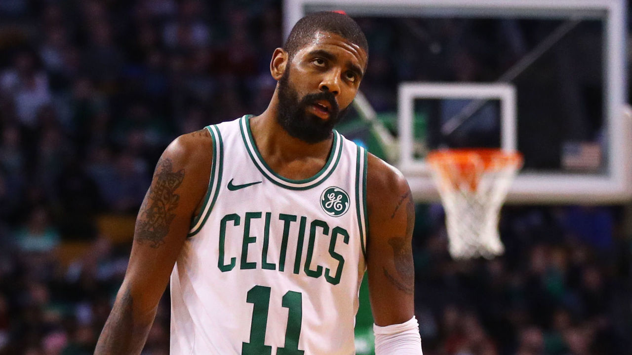 BOSTON, MA - JANUARY 3: LeBron James #23 of the Cleveland Cavaliers and Kyrie Irving #11 of the Boston Celtics look on during the second half at TD Garden on January 3, 2018 in Boston, Massachusetts.