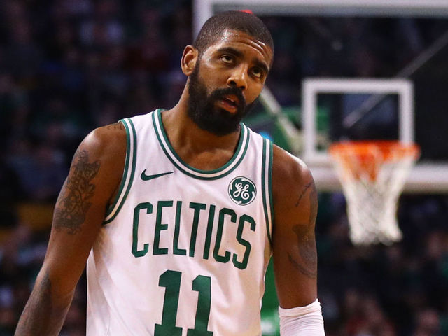 BOSTON, MA - JANUARY 3: LeBron James #23 of the Cleveland Cavaliers and Kyrie Irving #11 of the Boston Celtics look on during the second half at TD Garden on January 3, 2018 in Boston, Massachusetts.
