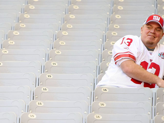 GLENDALE, AZ - JANUARY 29: Quarterback Jared Lorenzen #13 of the New York Giants sits in the stands during Giants media day for Super Bowl XLII at University of Phoenix Stadium on January 29, 2008 in Glendale, Arizona.