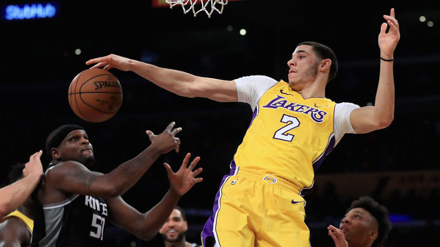 LOS ANGELES, CA - JANUARY 09: Lonzo Ball #2 of the Los Angeles Lakers battles Zach Randolph #50 of the Sacramento Kings for a rebound during the first half of a game at Staples Center on January 9, 2018 in Los Angeles, California.