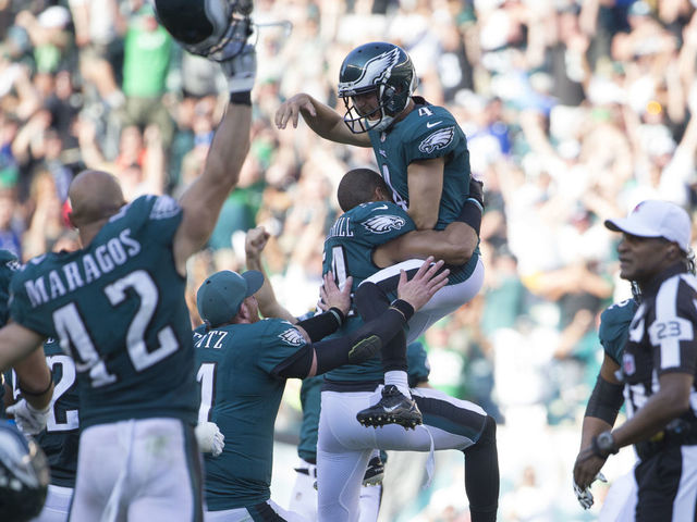 PHILADELPHIA, PA - SEPTEMBER 24: Jake Elliott #4 of the Philadelphia Eagles celebrates with Kamu Grugier-Hill #54, Carson Wentz #11, and Chris Maragos #42 after kicking the game winning field as time expired against the New York Giants at Lincoln Financial Field on September 24, 2017 in Philadelphia, Pennsylvania. The Eagles defeated the Giants 27-24.