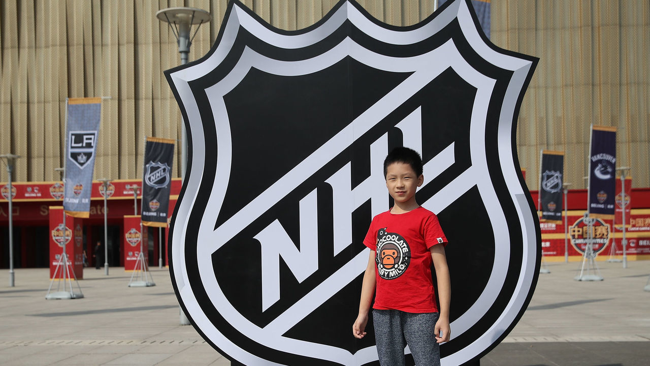 BEIJING, CHINA - SEPTEMBER 23: A young chinese fans poses for a picture before the pre-season game between the Los Angeles Kings and the Vancouver Canucks at Wukesong Arena on September 23, 2017 in Beijing, China.