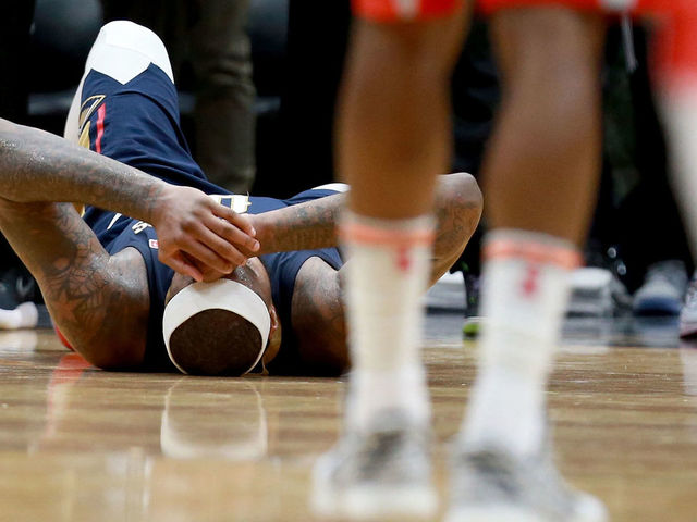 NEW ORLEANS, LA - JANUARY 26: DeMarcus Cousins #0 of the New Orleans Pelicans lies down on the ground after injuring his ankle during the second half of a NBA game against the Houston Rockets at the Smoothie King Center on January 26, 2018 in New Orleans, Louisiana.