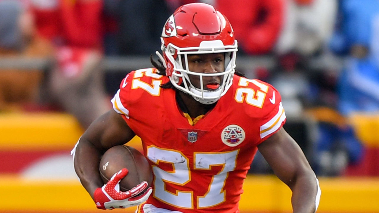 KANSAS CITY, MO - JANUARY 6:Running back Kareem Hunt #27 of the Kansas City Chiefs runs through a huge hole during the first quarter of the AFC Wild Card playoff game against the Tennessee Titans at Arrowhead Stadium on January 6, 2018 in Kansas City, Missouri.