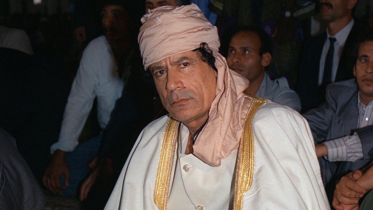 Libyan Head of State Colonel Moamer Kadhafi prays 21 July 1989 in Bamako during six-African-nation summit to resolve a territorial dispute between Libya and Chad. Kadhafi, born in 1942, formed in 1963 the Free Officers Movement, a group of revolutionary army officers, which overthrew 01 September 1969 King Mohammed Idris of Libya and proclaimed Libya, in the name of 'freedom, socialism and unity,' Socialist People's Jamahiriya.
