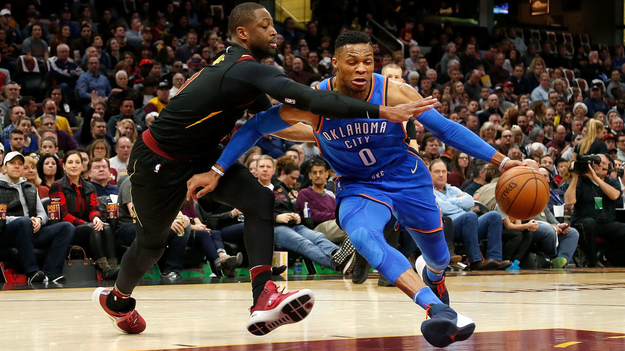 CLEVELAND, OH - JANUARY 20: Russell Westbrook #0 of the Oklahoma City Thunder attempts to drive the ball past Dwyane Wade #9 of the Cleveland Cavaliers during the first quarter at Quicken Loans Arena on January 20, 2018 in Cleveland, Ohio.