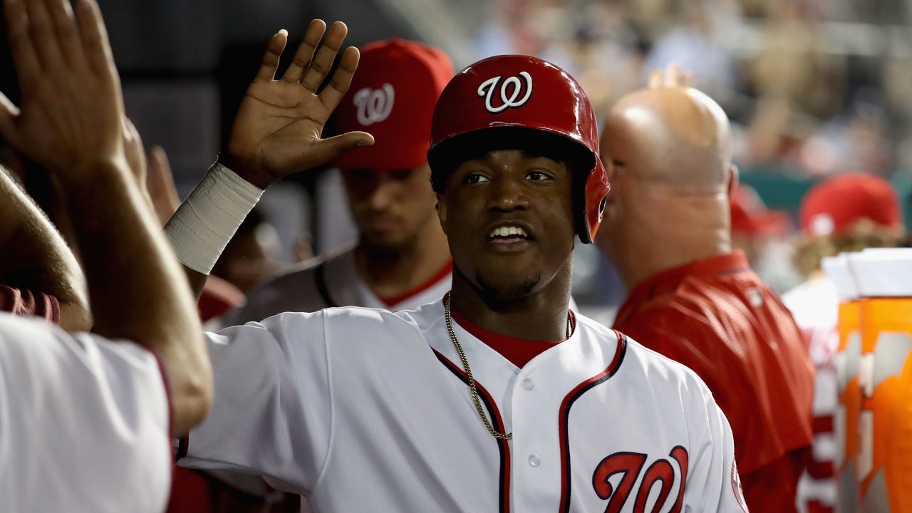 WASHINGTON, DC - SEPTEMBER 14: Victor Robles #14 of the Washington Nationals celebrates in the dugout after scoring in the sixth inning against the Atlanta Braves at Nationals Park on September 14, 2017 in Washington, DC.
