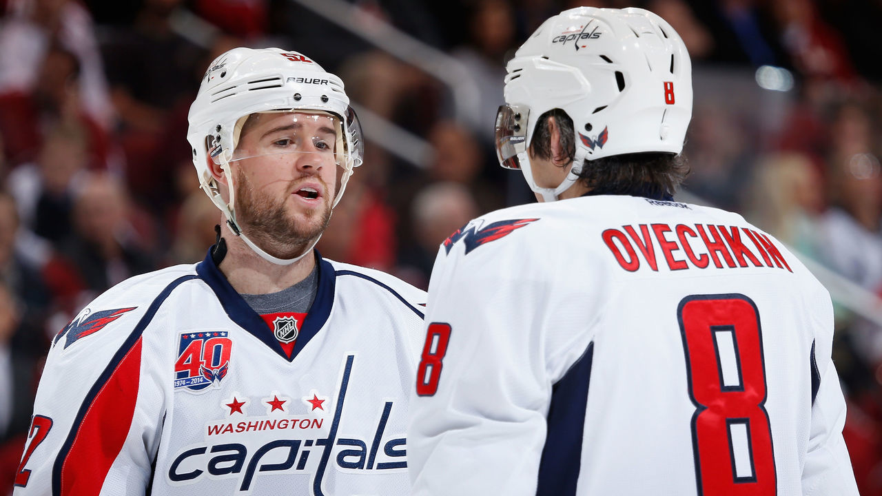 GLENDALE, AZ - NOVEMBER 18: Mike Green #52 of the Washington Capitals talks with Alex Ovechkin #8 during the NHL game against the Arizona Coyotes at Gila River Arena on November 18, 2014 in Glendale, Arizona. The Capitals defeated the Coyotes 2-1 in overtime.