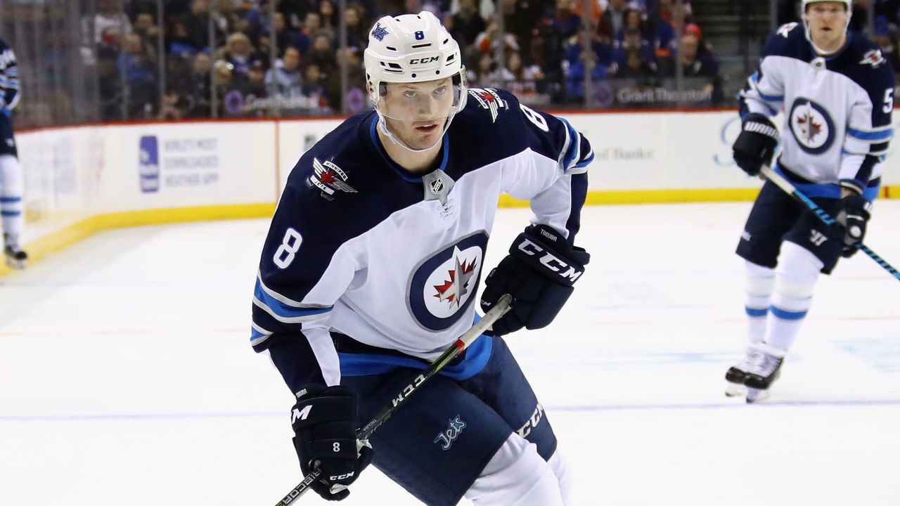 NEW YORK, NY - DECEMBER 23: Jacob Trouba #8 of the Winnipeg Jets skates against the New York Islanders at the Barclays Center on December 23, 2017 in the Brooklyn borough of New York City. The Islanders defeated the Jets 5-2.