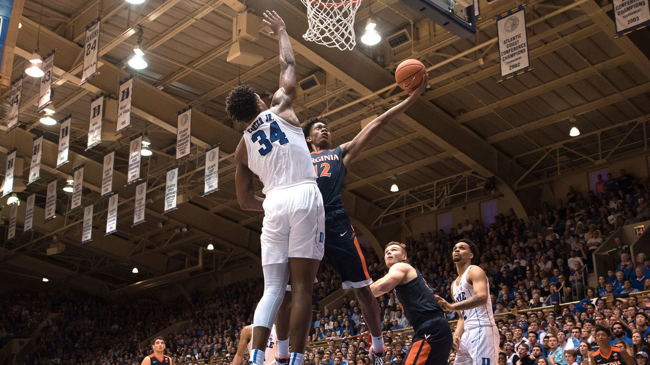 DURHAM, NC - JANUARY 27: De'Andre Hunter #12 of the Virginia Cavaliers goes to the basket against Wendell Carter, Jr. #34 of the Duke Blue Devils at Cameron Indoor Stadium on January 27, 2018 in Durham, North Carolina. Virginia won 65-63.