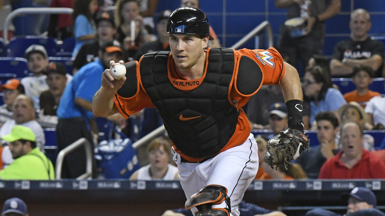 MIAMI, FL - AUGUST 28: J.T. Realmuto #11 of the Miami Marlins runs towards 3rd base during a run down in the 4th inning against the San Diego Padres at Marlins Park on August 28, 2016 in Miami, Florida.