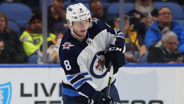 BUFFALO, NY - JANUARY 9: Jacob Trouba #8 of the Winnipeg Jets in play against the Buffalo Sabres at the KeyBank Center on January 9, 2018 in Buffalo, New York. The Jets beat the Sabres 7-4.