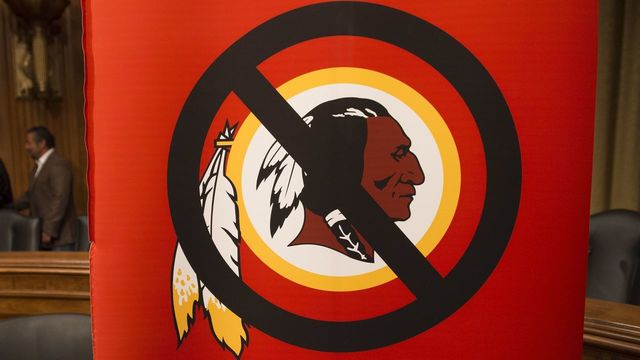 A poster for the 'Change the Mascot' campaign is seen prior to a press conference by the Oneida Indian Nation leaders on Capitol Hill in Washington, DC, September 16, 2014. 'Change the Mascot' is a national campaign to end the use of the racial slur Redskins as the mascot and name of the NFL team in Washington, DC. Launched by the Oneida Indian Nation, the campaign calls upon the NFL and Commissioner Roger Goodell to do the right thing and bring an end the use of the racial epithet. AFP PHOTO / Saul LOEB