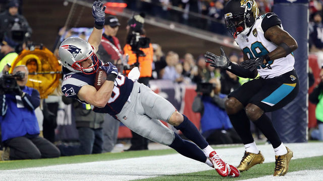 FOXBOROUGH, MA - JANUARY 21: Danny Amendola #80 of the New England Patriots catches a touchdown pass as he is defended by Tashaun Gipson #39 of the Jacksonville Jaguars in the fourth quarter during the AFC Championship Game at Gillette Stadium on January 21, 2018 in Foxborough, Massachusetts.