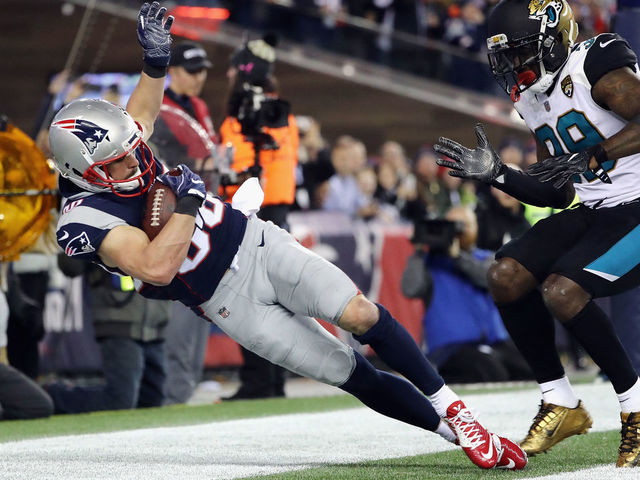 FOXBOROUGH, MA - JANUARY 21: Danny Amendola #80 of the New England Patriots catches a touchdown pass as he is defended by Tashaun Gipson #39 of the Jacksonville Jaguars in the fourth quarter during the AFC Championship Game at Gillette Stadium on January 21, 2018 in Foxborough, Massachusetts.