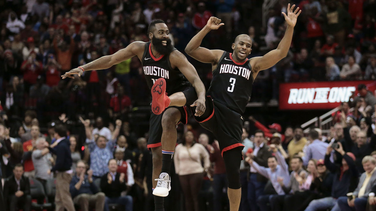HOUSTON, TX - JANUARY 22: James Harden #13 and Chris Paul #3 of the Houston Rockets celebrate after Paul made a three-point shot late in the fourth quarter Miami Heat at Toyota Center on January 22, 2018 in Houston, Texas.
